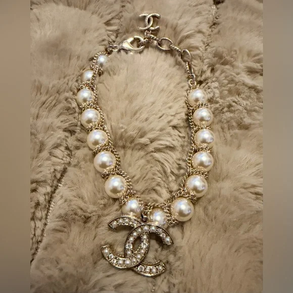 Gold-Tone Pearl Bracelet with Crystallized Logo Pendant - Picture 2 of 7